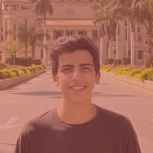 A photograph of Fares in front of Cairo University's Dome